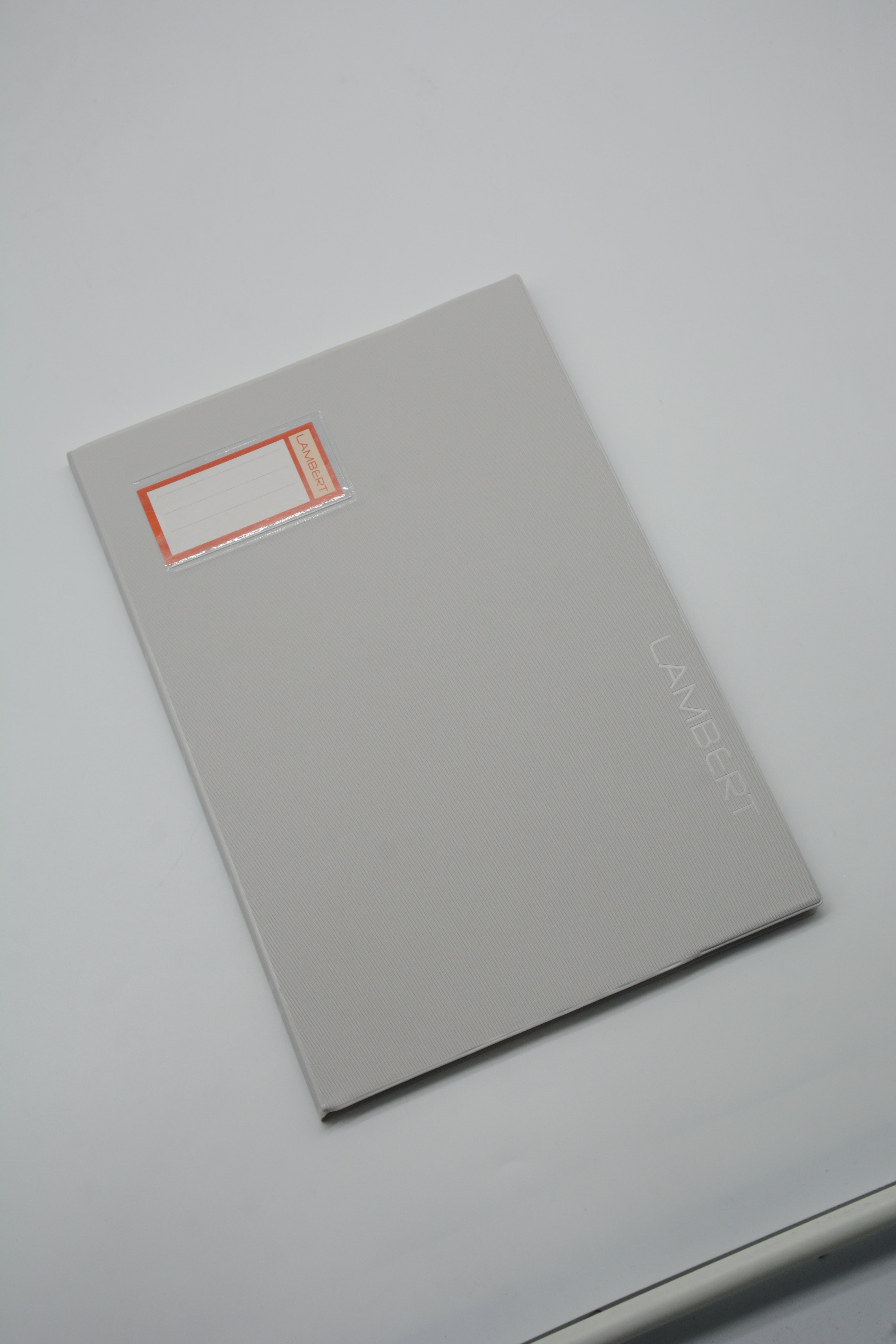 LAMBERT SOLID COLOUR PVC JACKET 100SHT 10MM SQUARE NOTEBOOK A4-LIGHT GREY